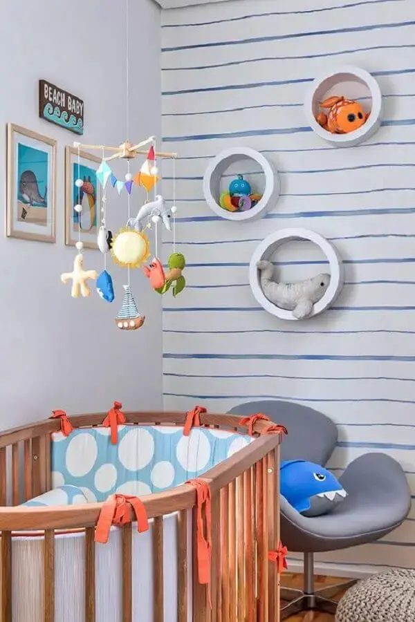 nicho redondo para quarto de bebê decorado com tema fundo do mar nicho redondo para quarto de bebê decorado com tema fundo do mar Foto Doob Arquitetura