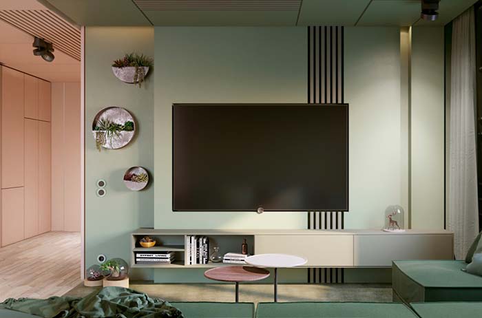 Sala com painel verde pastel e decoração minimalista